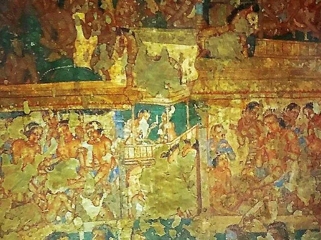 Ancient wall painting depicting a bustling scene with many figures at Ajanta Caves.